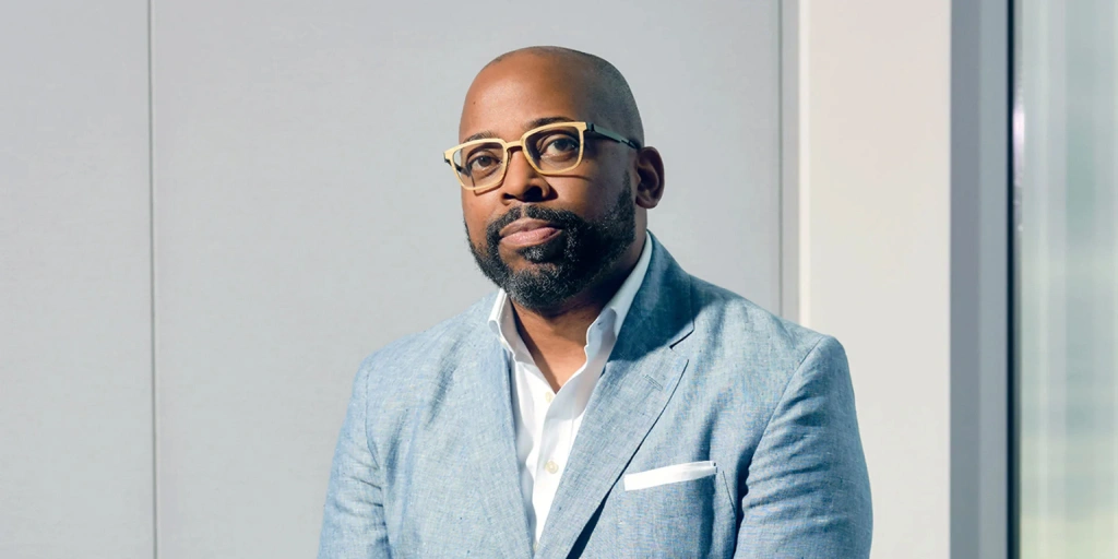 Ellis Carr, the president and CEO of Capital Impact Partners and CDC Small Business Finance, has been selected by Fast Company in the business publication’s 14th annual list of the Most Creative People in Business. He is pictured here, wearing glasses and a gray suit, looking at the camera.