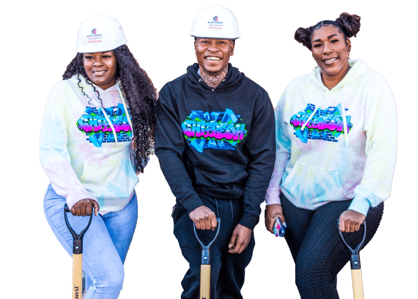 Three small business entrepreneurs pose for image at groundbreaking