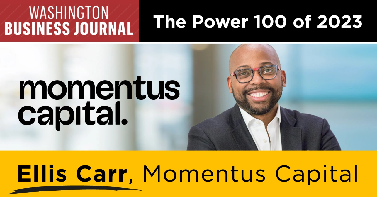 A graphic featuring the logo of the Washington Business Journal, the words "The Power 100 of 2023," the logo for Momentus Capital, a smiling photo of Ellis Carr dressed in a suit with a pair of glasses, and the words "Ellis Carr, Momentus Capital"