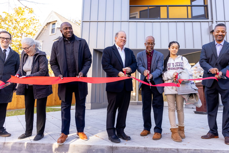 Developer Richard Hosey and Detroit Mayor Mike Duggan cut the ribbon at a new affordable housing complex in Detroit.