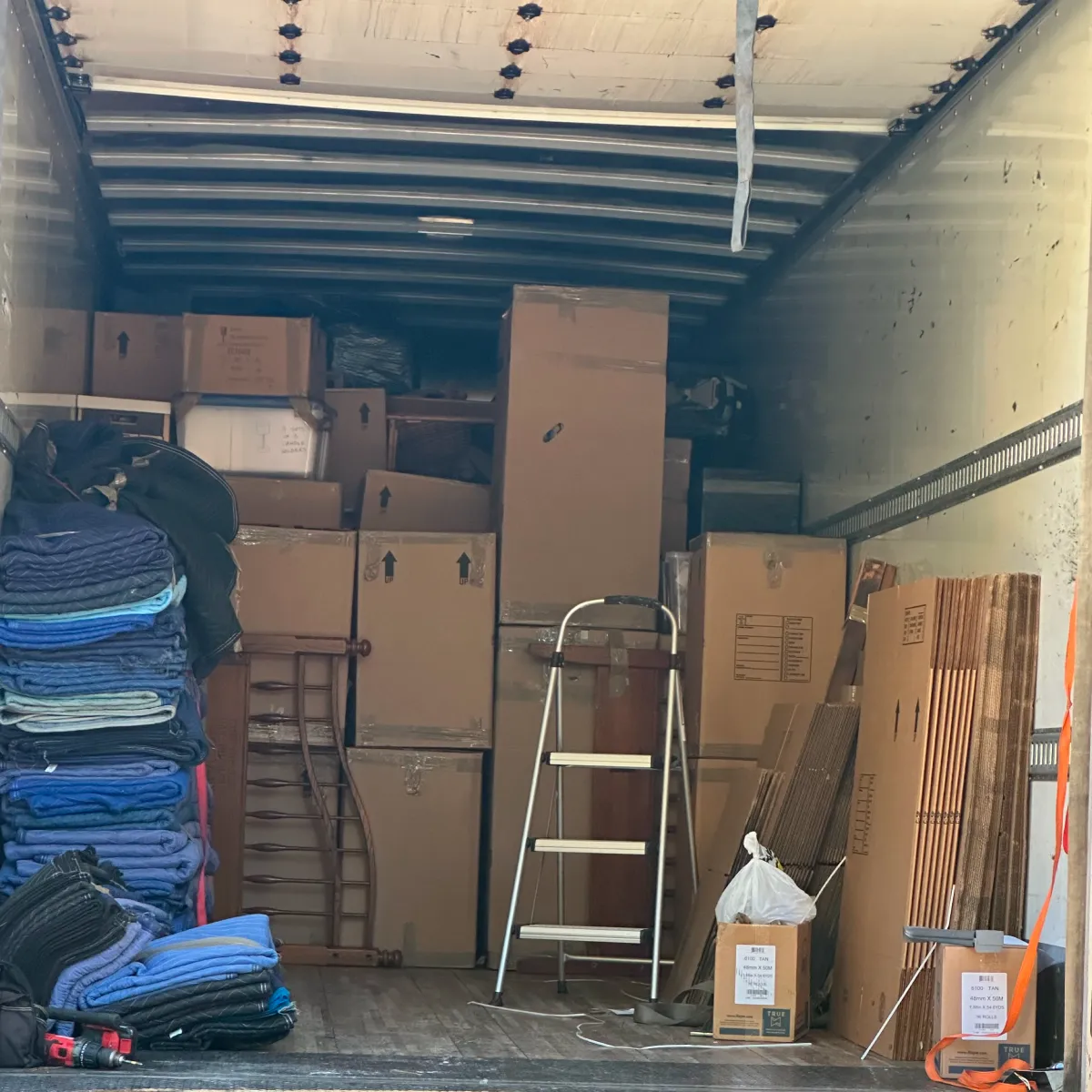 911 Flood Warriors performing a contents packout to protect household items, highlighted as a trusted Momentus Capital borrower in this holiday gift guide for local businesses.