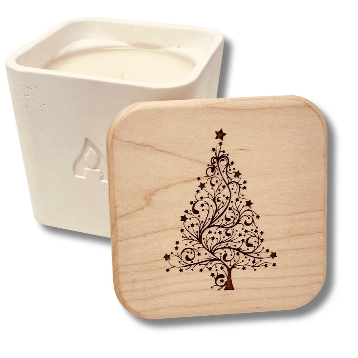 An Amador Candle in its signature, rounded square candle jar with a maple lid and a custom engraving of a holiday tree featured in the Momentus Capital holiday gift guide to support small businesses as a home and decor gift.