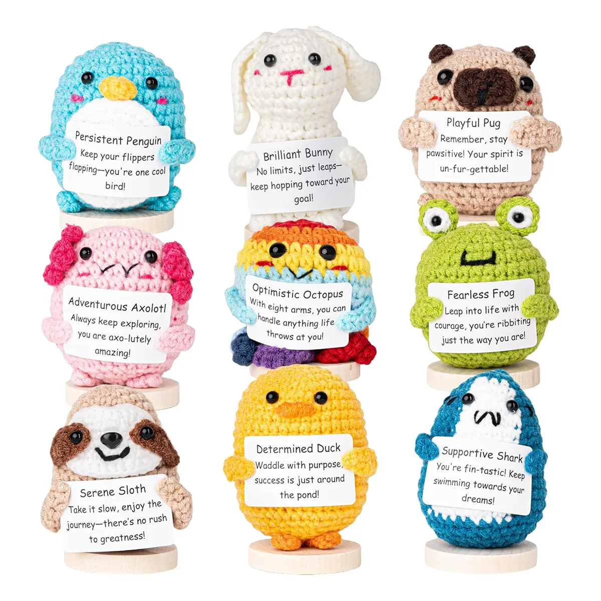 Nine Cheerspace handmade crocheted animals holding encouraging signs featured in the Momentus Capital holiday gift guide to support small businesses as a home and decor gift.
