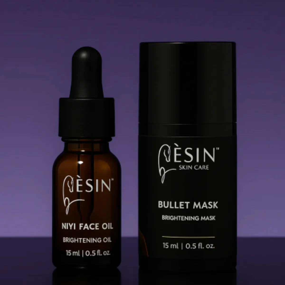 Two travel sized bottles that make up the Èsín Skincare Power of Radiance Travel Pack - Bullet Mask & Niyi Oil, featured in the Momentus Capital small business gift guide as a Wellness and self-care gift.
