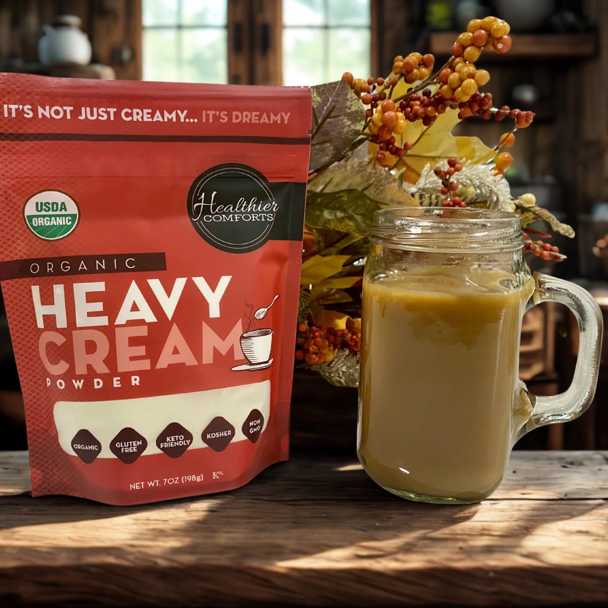 Healthier Comforts organic heavy cream powder shown in a clean pantry setting, featured in the Momentus Capital small business gift guide as a gourmet food gift.