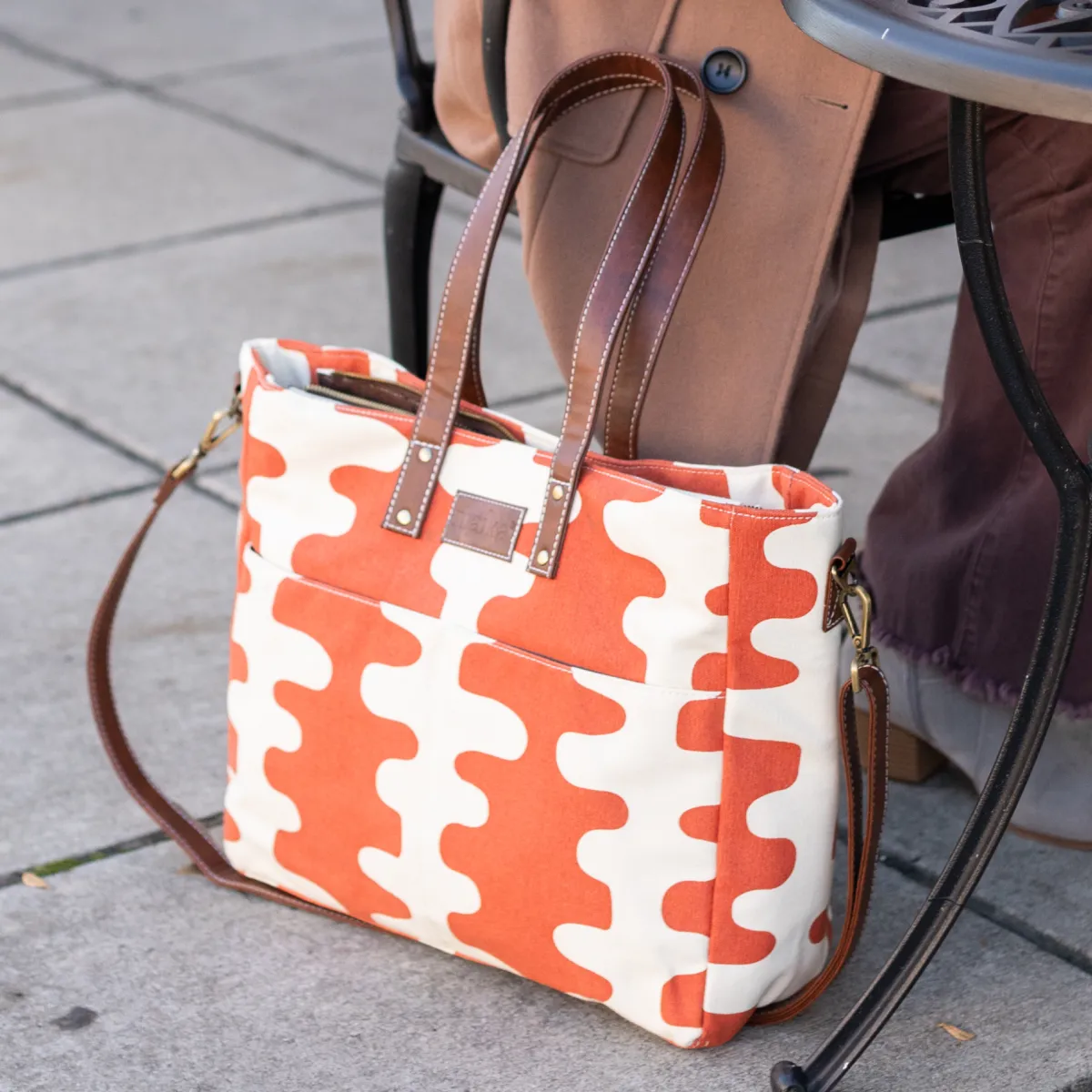 MAIKA Essential Tote displayed with its organizer pockets and modern design, featured in the Momentus Capital holiday gift guide to support small businesses.