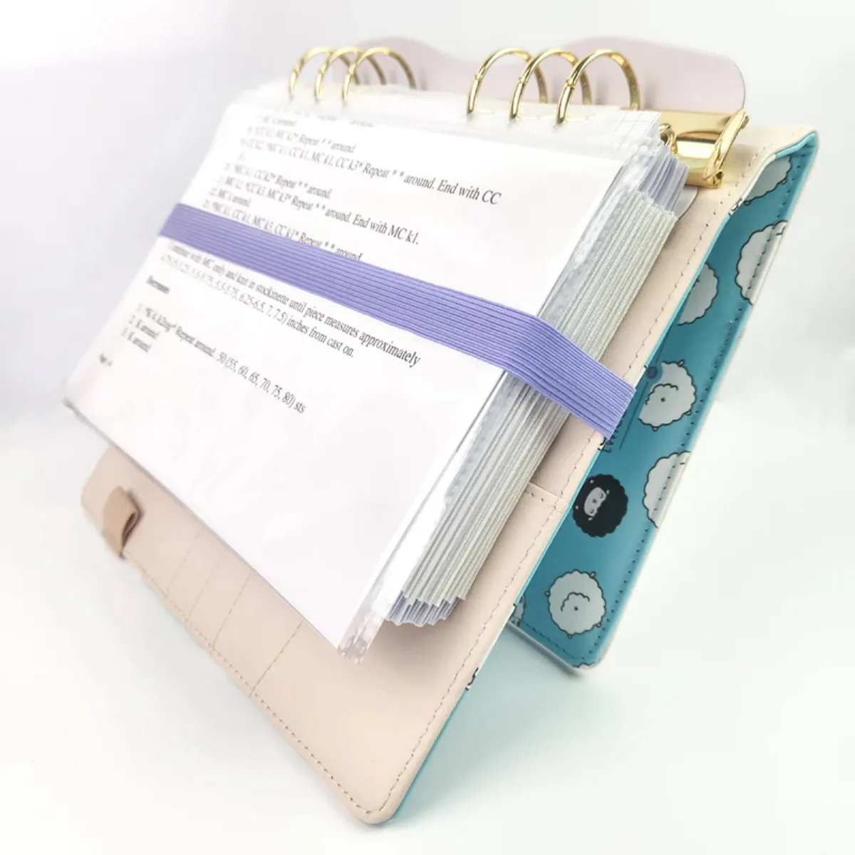 The Yarny Way project journal and planner displayed with knitting supplies, included as a creative holiday gift idea from a Momentus Capital borrower.