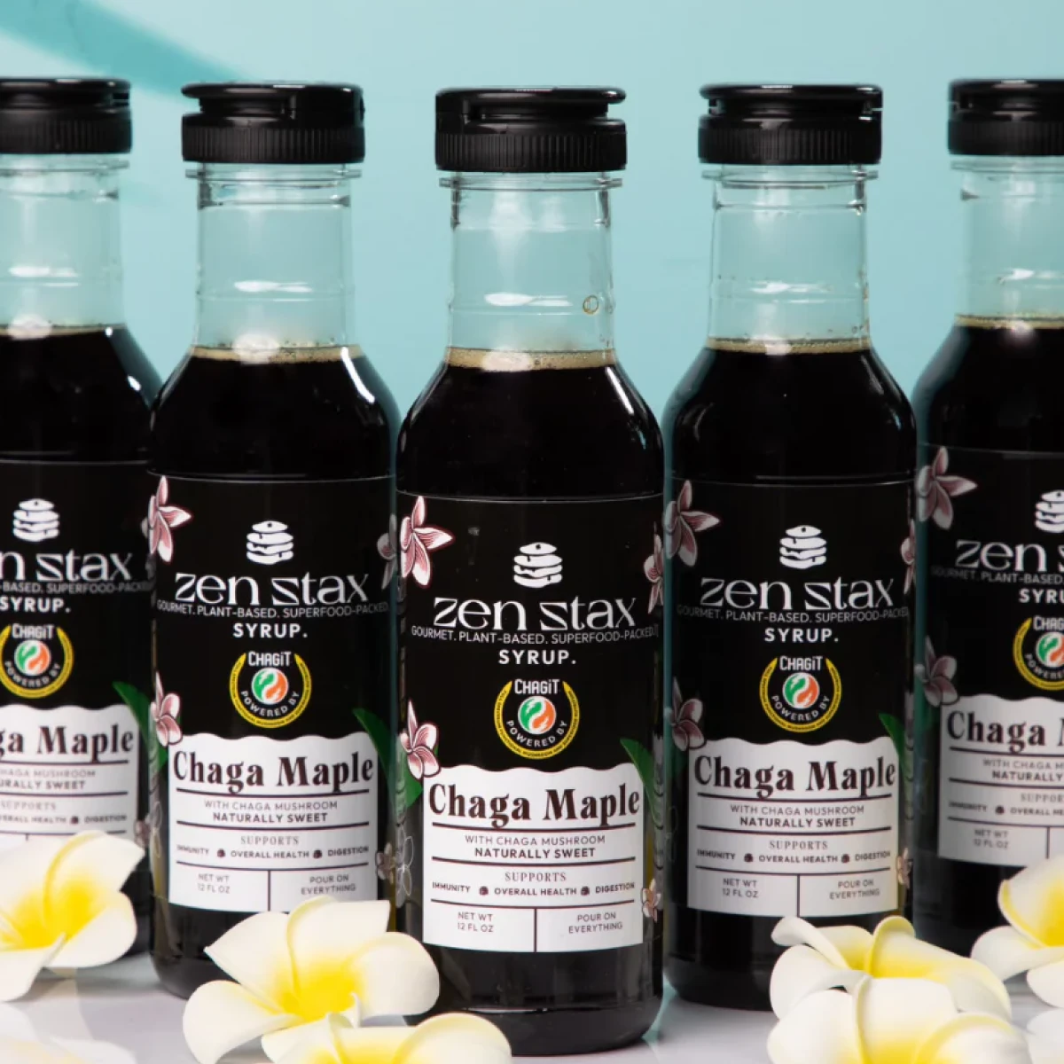 Stax Chaga Maple Syrup displayed in a clean kitchen setting, highlighted in the Momentus Capital small business gift guide as a unique gourmet holiday gift.