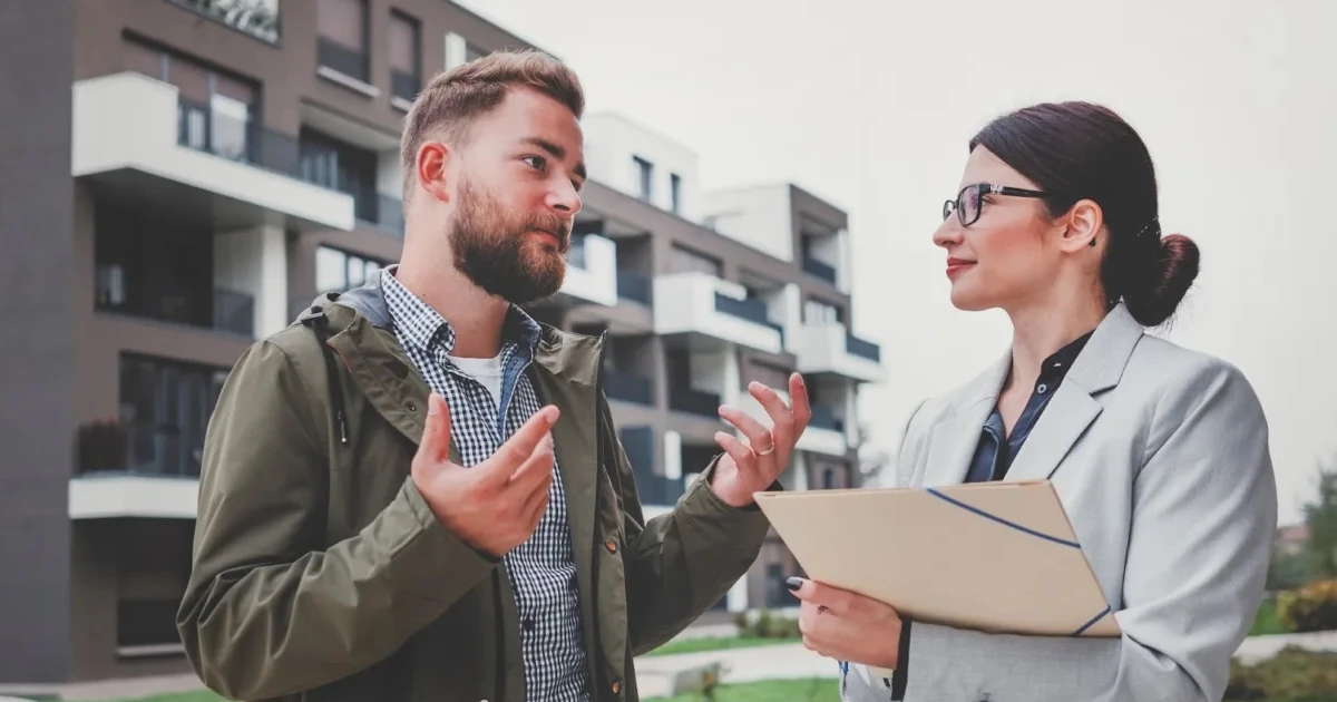 A lender and a borrower discussing New Markets Tax Credit (NMTC) financing options.